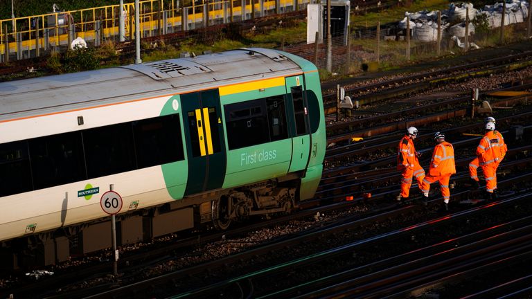 Engineers work on a derailed train at Selhurst train depot in southeast London. Pic: PA