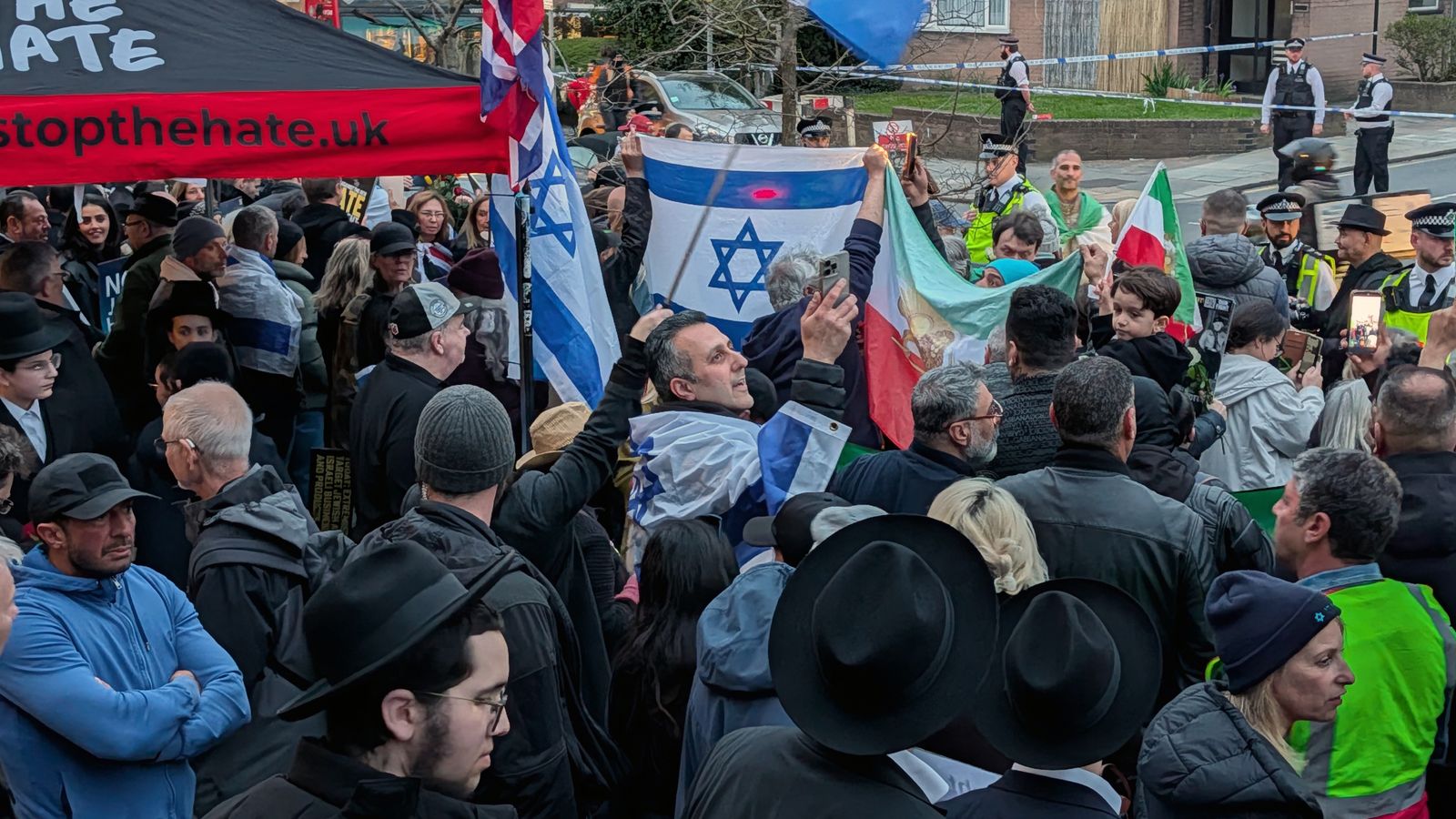 Protesters rally to 'stop the hate' in Golders Green, London