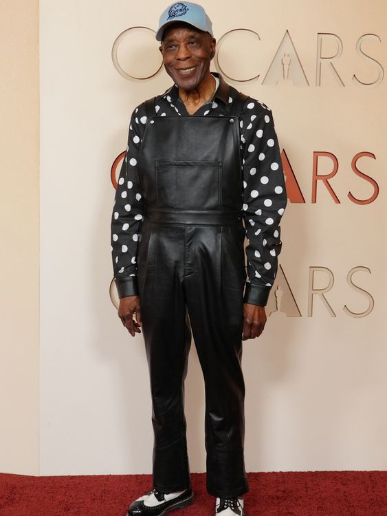 Blues legend and Sinners star Buddy Guy brings a spot of black leather to the carpet. Pic: AP