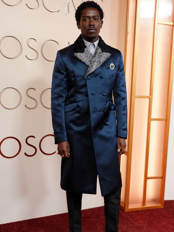 F1 star Damson Idris in an indigo and grey tailored jacket. Pic: AP