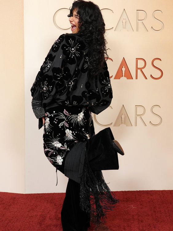 Marty Supreme star Odessa A'zion in a cheeky mood in black, silver and tassels. Pic: AP