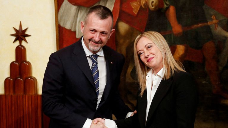Andrea Delmastro with Italian Prime Minister Giorgia Meloni. Pic: Reuters