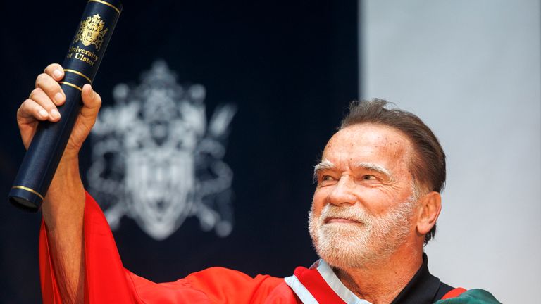 Arnold Schwarzenegger with his honorary doctorate at Ulster University in Belfast. Pic: PA