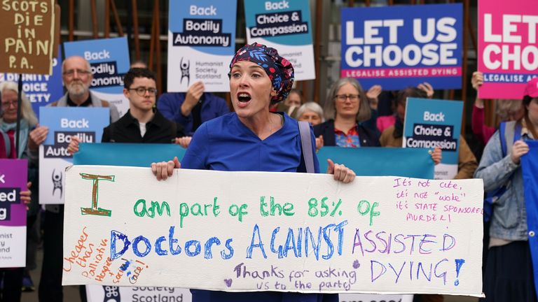 A doctor protesting against the bill at Holyrood last year. Pic: PA