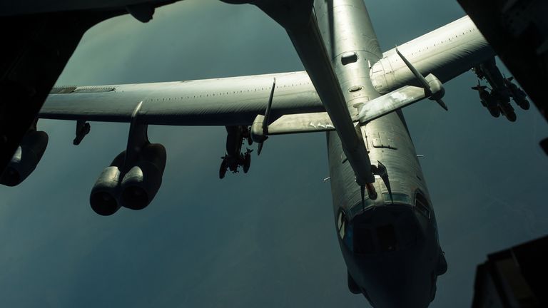 A US B-52 bomber during mid-air refuelling. Pic: Reuters