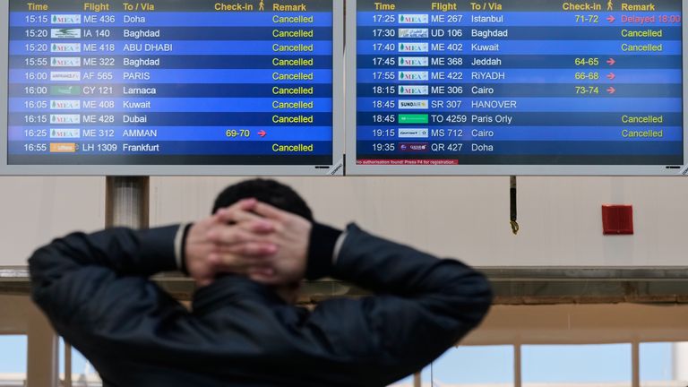 A traveller checks departure times at Beirut Rafik Hariri International Airport in Lebanon. Pic: AP