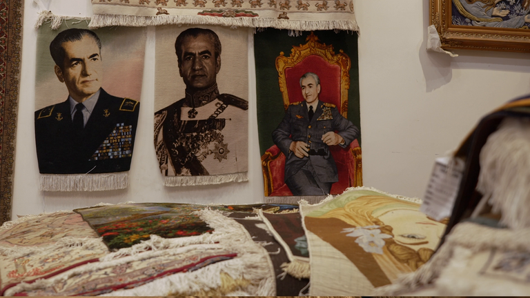 Portraits of the shahs are displayed on the shop's walls