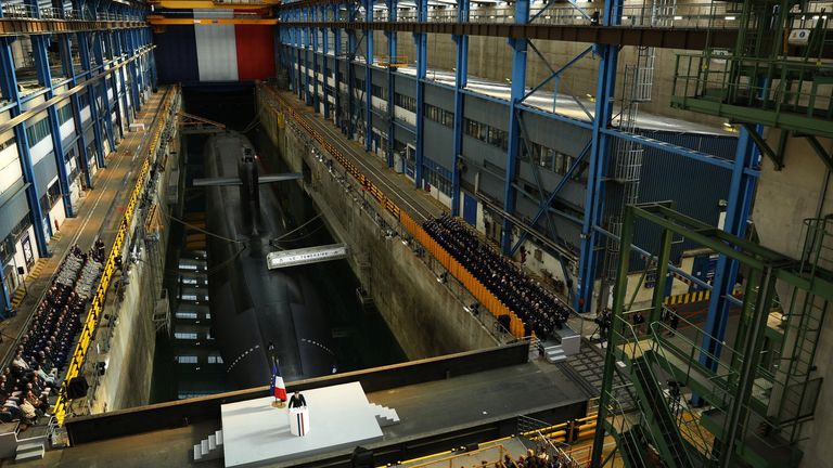 Macron's speech took place in front of France's Le Temeraire nuclear submarine. Pic: Reuters