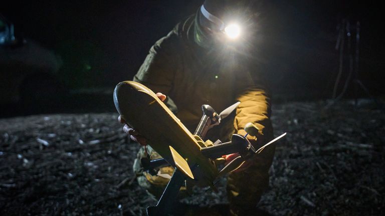 A Ukrainian soldier prepares an interceptor drone during Russia's aerial attack on Ukraine. Pic: AP