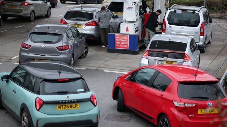 Long queues have formed at UK petrol stations as drivers try and get ahead of surging petrol prices. Pic: Reuters