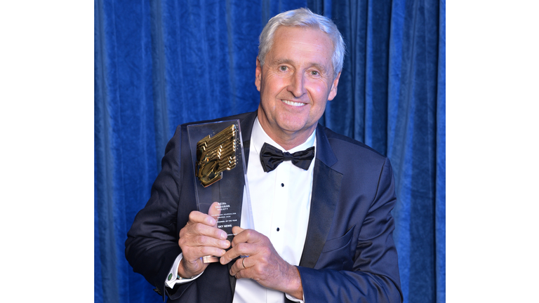 Presenter Mark Austin with the News Channel of the Year award. Pic: RTS/Richard Kendal