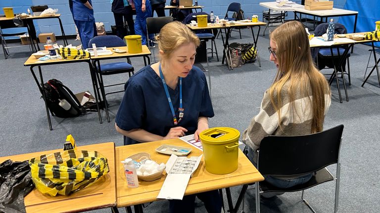 Medical staff hand out vaccines and antibiotics to students in the sports hall at the University of Kent campus in Canterbury. Pic: PA