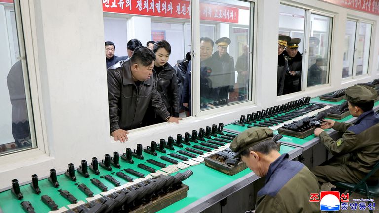 Kim Jong Un, accompanied by his daughter Kim Ju Ae, visits a munitions factory in North Korea. Pic: Reuters