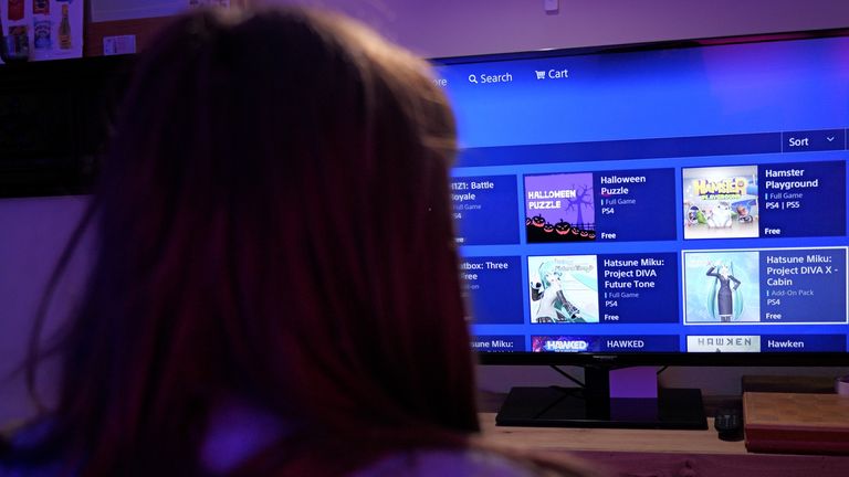 Person picks a game on the PlayStation Store