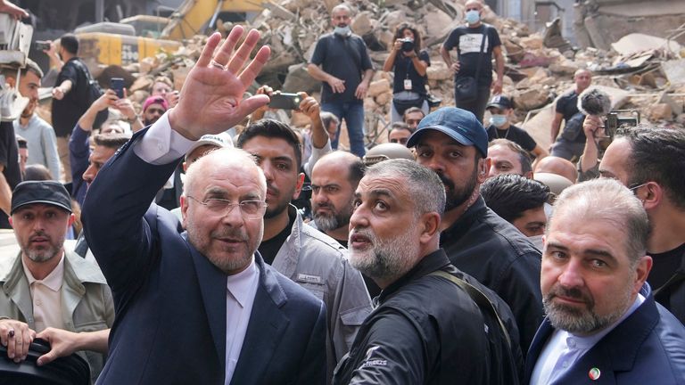 Ghalibaf waves to residents as he visits the site of an Israeli airstrike in Beirut in October 2024. Pic: AP