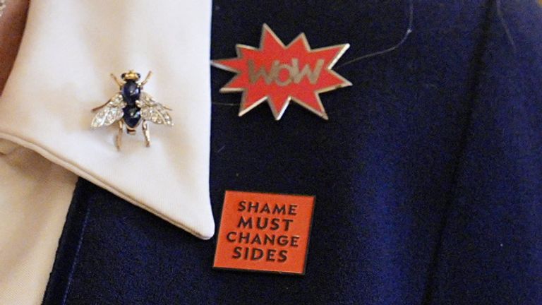 Camilla wore a lapel badge that says 'Shame Must Change Sides' that she was given by French abuse survivor Gisèle Pelicot. Pic: Reuters