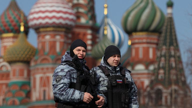 Officers stood outside St. Basil's Cathedral. Pic: Stock/Reuters