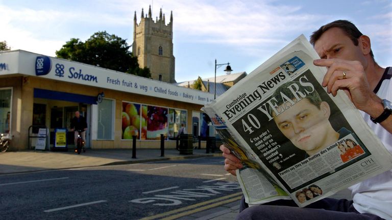 A man reads the Cambridge Evening News in Soham Village in 2005. Pic: PA