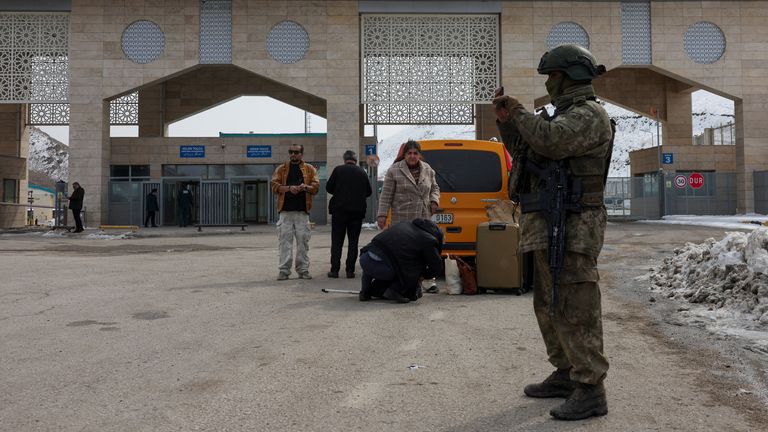A Turkish soldier stands guard in front of the Kapikoy Border Gate in the eastern Van province. Pic: Reuters