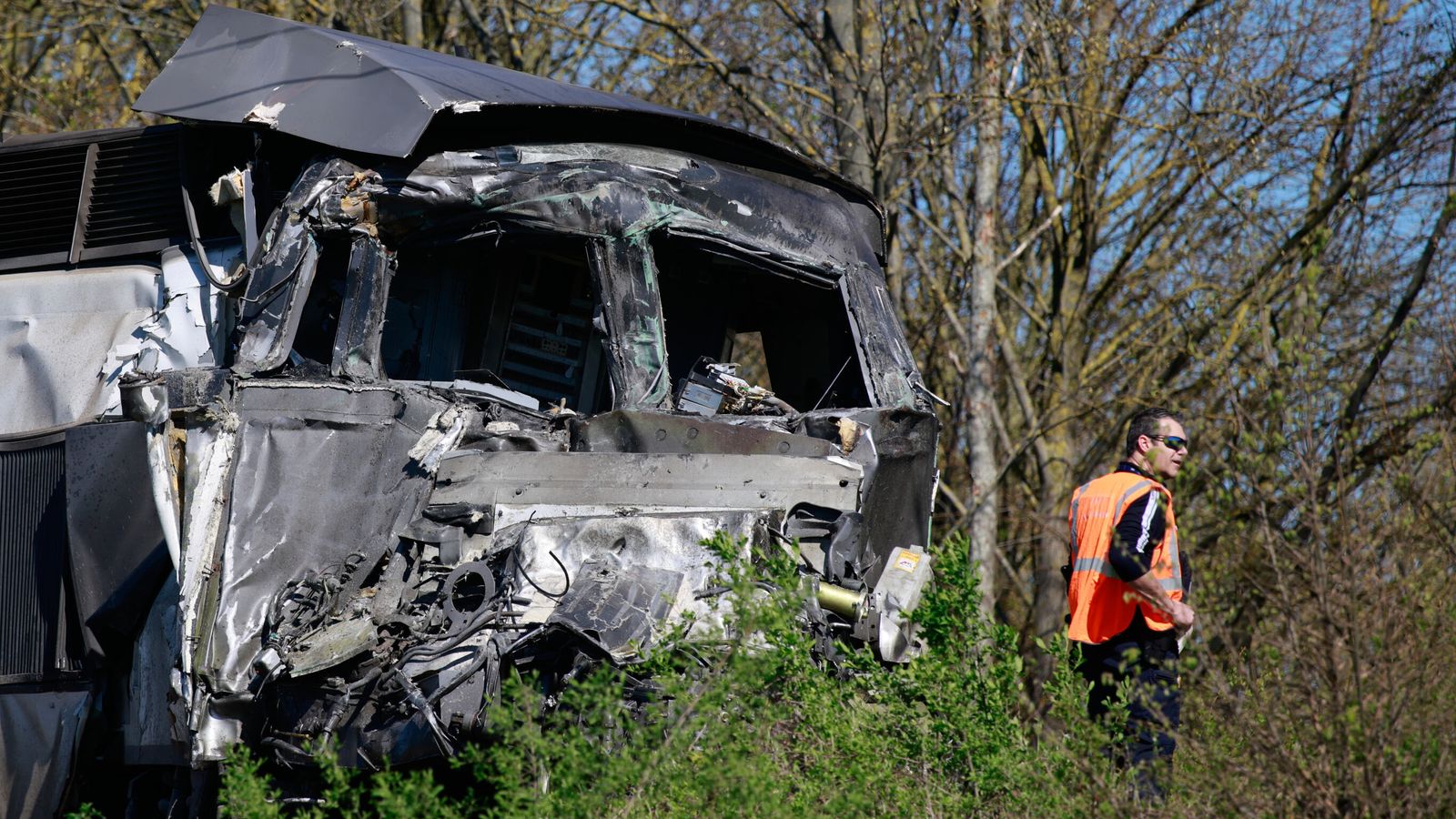 Train driver dead and 16 injured after crash with lorry carrying ...