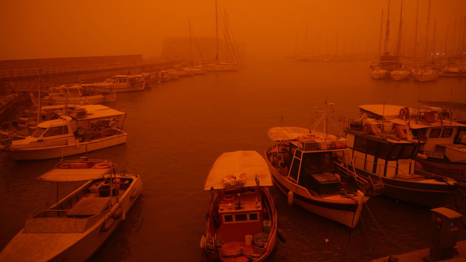 Greek island of Crete is cloaked by Saharan dust storm – turning its blue skies blood red