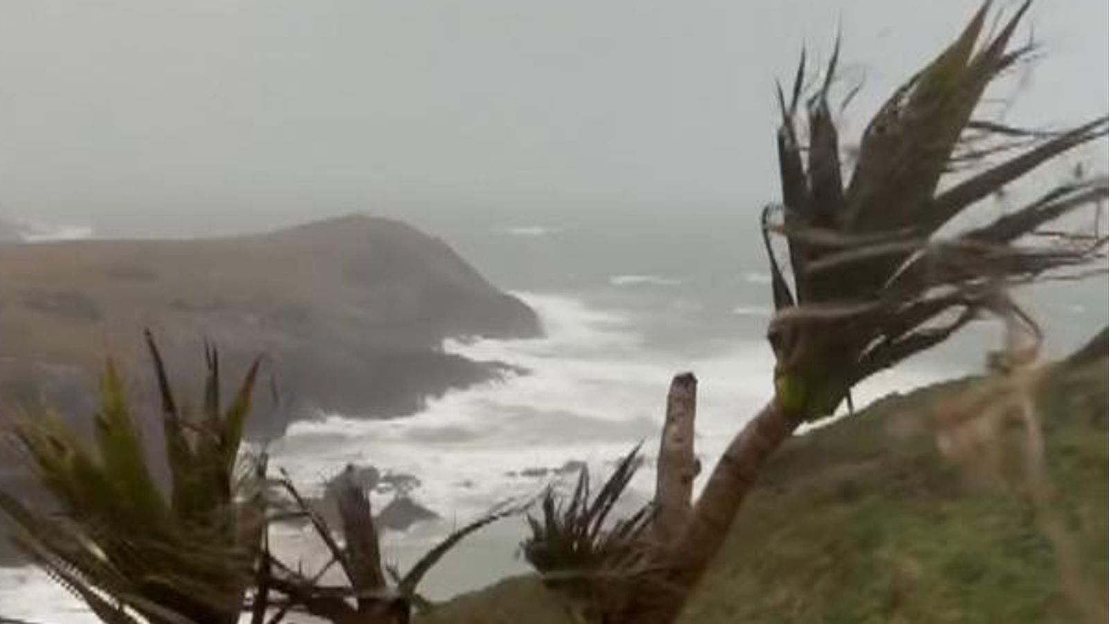 Battered coasts, wobbly planes and closed roads as Storm Dave sweeps through the UK