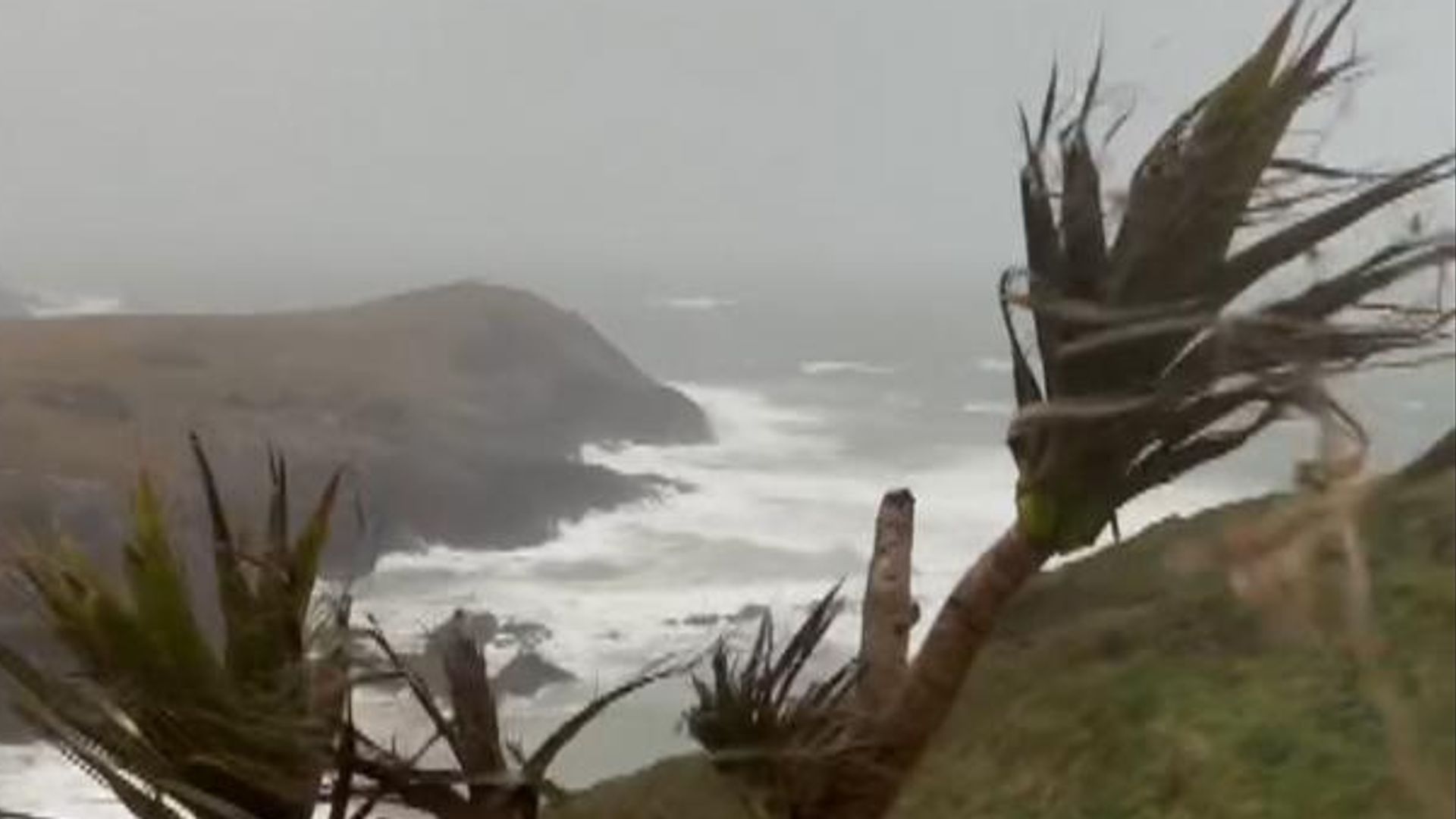 Battered coasts, wobbly planes and closed roads as Storm Dave sweeps through the UK
