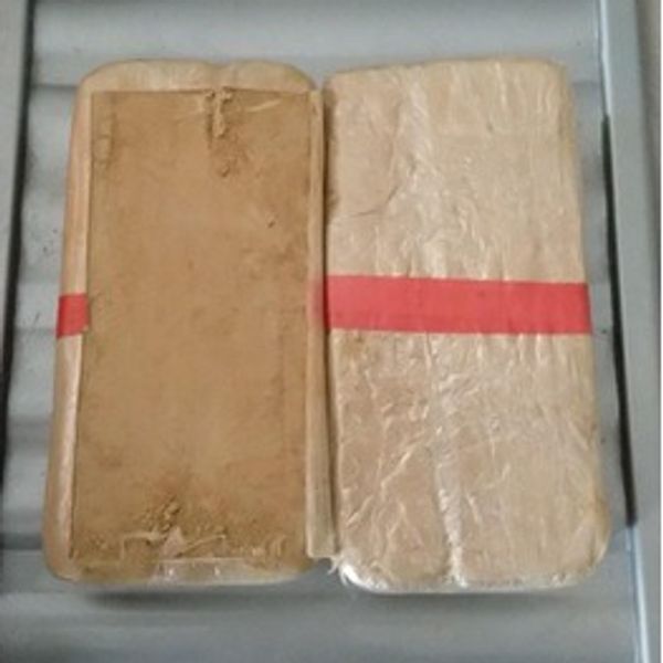 Two compressed blocks of brown powder. Pic: Crown Office