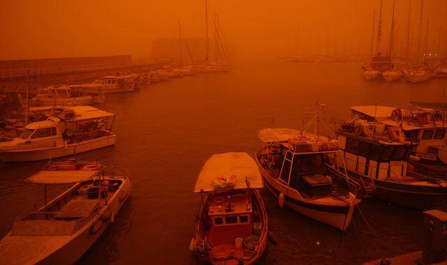 Greek island of Crete is cloaked by Saharan dust storm - turning its blue skies blood red