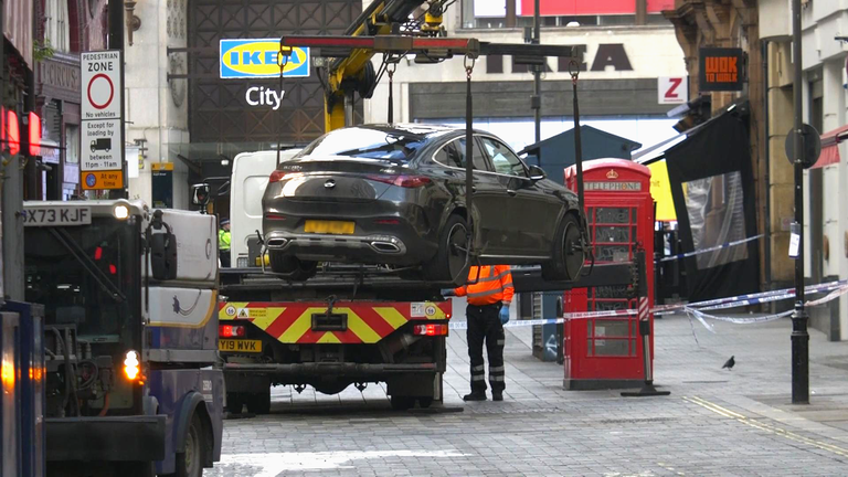 A car was later seen being removed from the scene