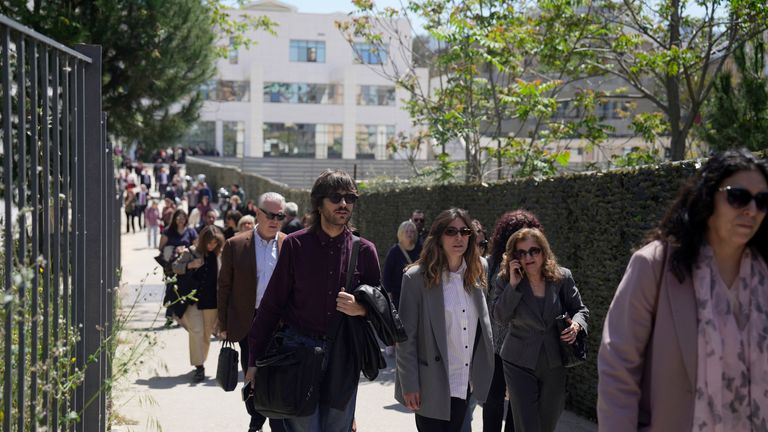 People leave the courthouse after the gunman opened fire.
Pic: AP