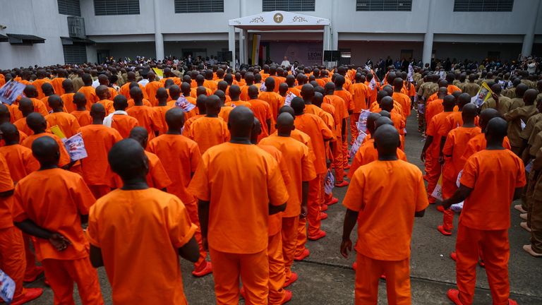 Inmates line up as Pope Leo XIV visits the Bata prison in Bata, Equatorial Guinea. Pic: Reuters