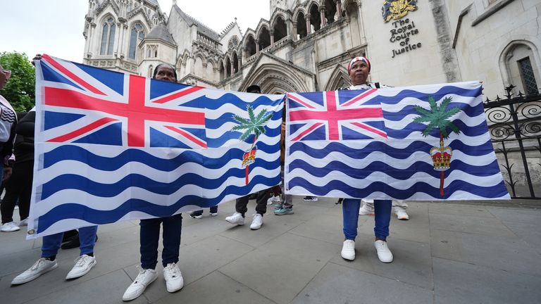 Protesters outside the High Court in central London after the Chagos Islands deal was challenged in court last year. Pic: PA