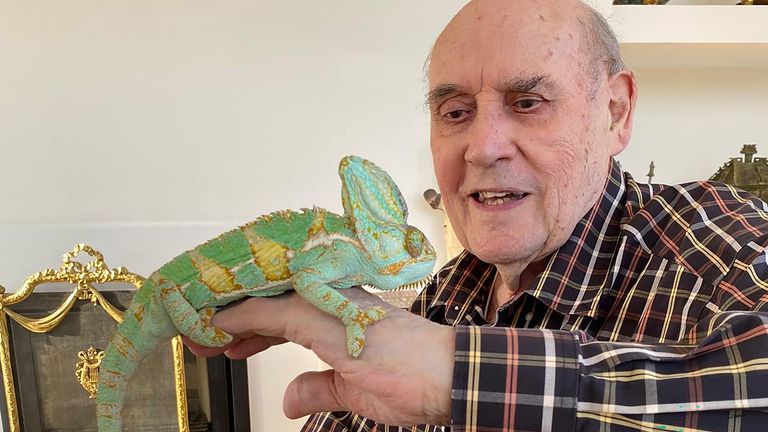 Morris with an iguana. Pic: PA