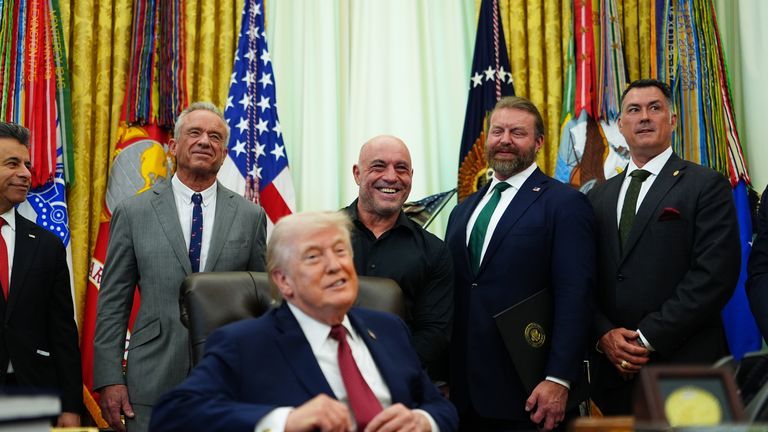 Marcus Luttrell (second right) told the president 'you're going to save a lot of lives'. Pic: AP