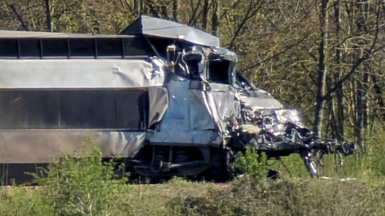 Train driver dead and 16 injured after crash with lorry carrying ...