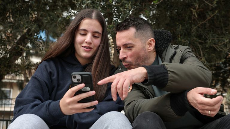 Dimitris Daniil, 44 and his daughter Katerina. Pic: Reuters