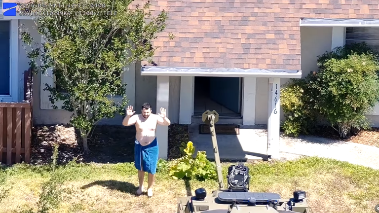 Hisham Abugharbieh surrendering to police after a brief standoff in Tampa on Friday. Pic: Hillsborough County Sheriff's Office.