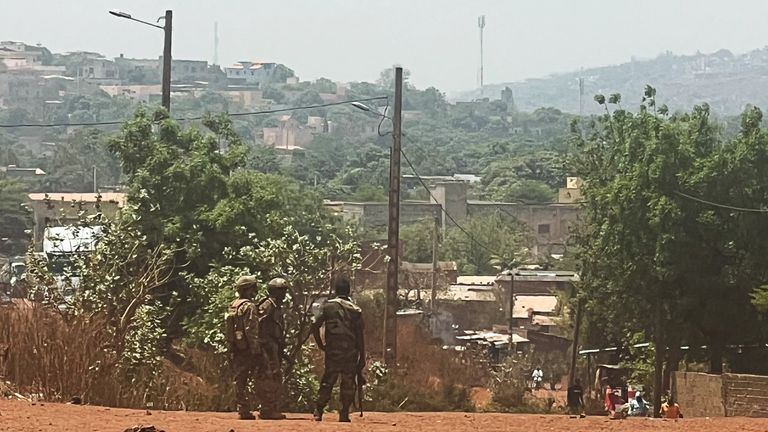 Malian soldiers on patrol following an attack on Mali's main military base in Kati. Pic: Reuters