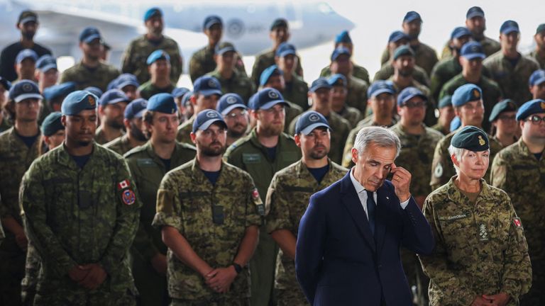 Canadian Prime Minister Mark Carney and General Jennie Carignan, chief of defence staff, during a national defence announcement in 2025