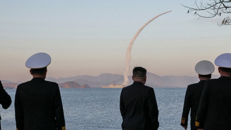 Kim observes as missiles are test-fired from the destroyer Choe Hyon. Pic: Reuters