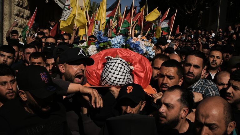 Mourners carry Mr Awawdeh's body. Pic: AP