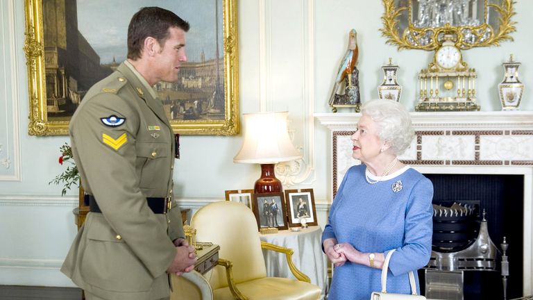 Victoria Cross recipient Ben Roberts-Smith with Queen Elizabeth II.
Pic: AP