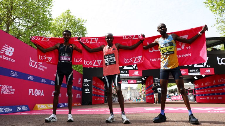 Kenyan Sawe celebrates with runner-up Yomif Kejelcha from Ethiopia and third-placed Jacob Kiplimo from Uganda. Pic: Reuters