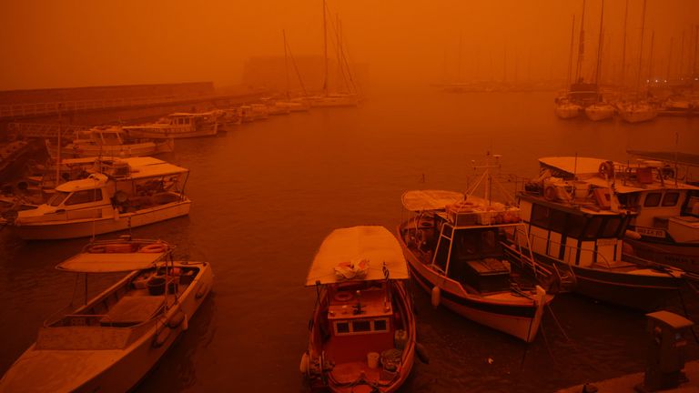 A view of the port in Heraklion, Crete, which is cloaked by red dust from Africa. Pic: Reuters