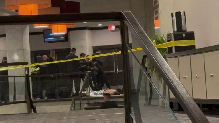 Cole Allen, a suspect in the shooting at the White House correspondents' association dinner, is seen on the floor. Pic: Reuters