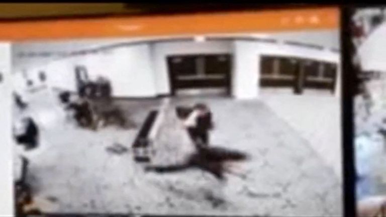 The moment the suspect attempts to dash past security, captured on CCTV. Pic: Reuters/via Truth Social