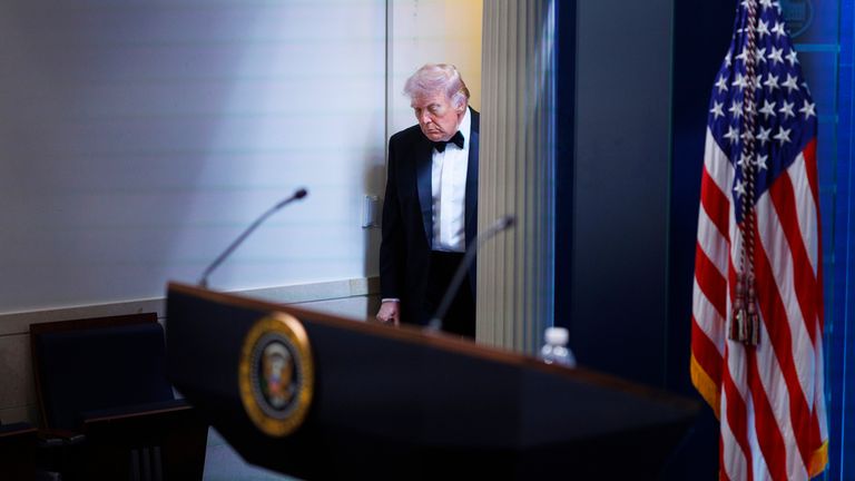 Donald Trump arrives at the James Brady Press Briefing Room after the incident. Pic: AP/Tom Brenner