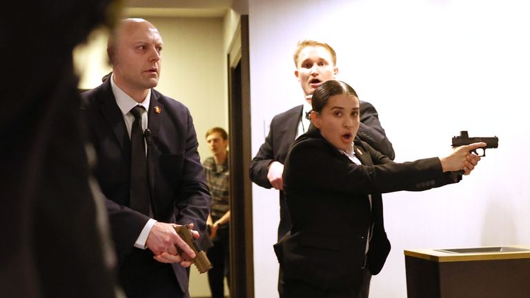 Secret Service agents respond to the shooting. Pic: AP
