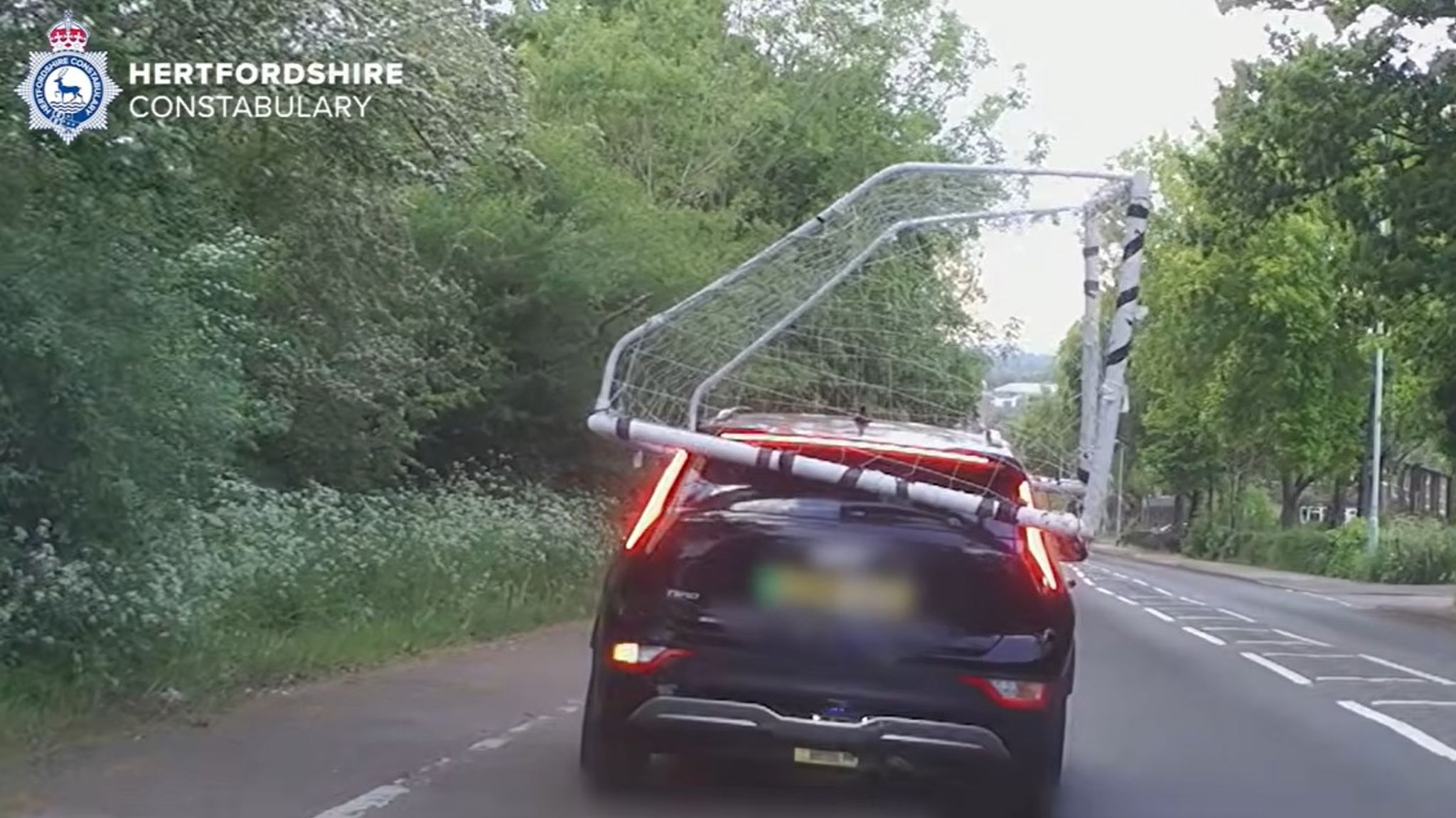 Driver filmed with football net on top of car | UK News | Sky News